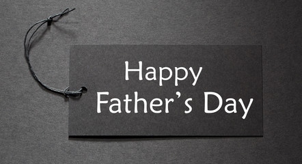 Wall Mural - Happy Fathers Day message on a black tag