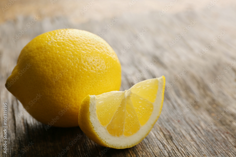 Fresh lemon on wooden background