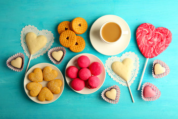 Canvas Print - Valentine concept. Composition of cookies and candies on blue background