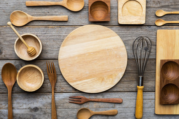 Wall Mural - various kitchen utensils on wooden table background