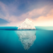 iceberg with cloudy sky