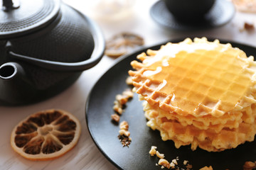 Wall Mural - Fresh tasty waffles with honey on wooden background