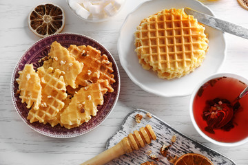 Wall Mural - Fresh crumbled waffles on plate, top view