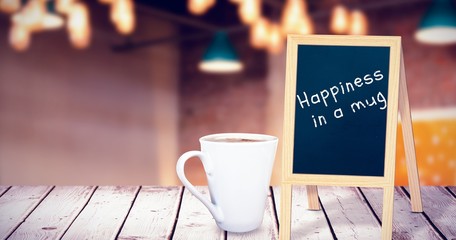 Poster - Composite image of cup of coffee on table 