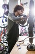 © Wavebreak Media - Worker repairing bicycles