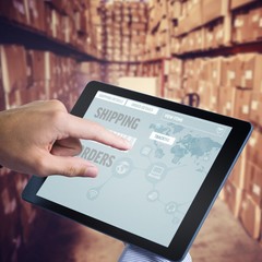 Poster - Composite image of man using tablet pc 