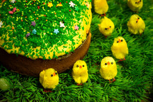 Easter Celebrating Cake On Green Grass With Yellow Toy Chickens