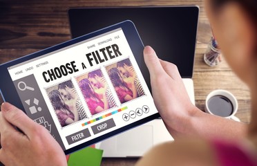 Poster - Composite image of woman using tablet pc