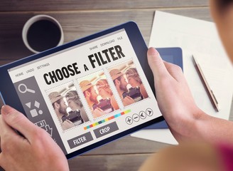 Poster - Composite image of woman using tablet pc
