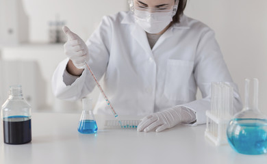 close up of scientist making test in lab