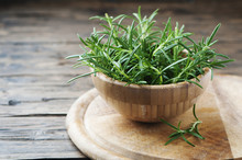Fresh Green Aromatic Rosemary On The Wooden Table