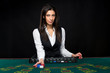 © nazarovsergey - The beautiful girl, dealer, behind a table for poker