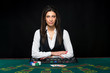 © nazarovsergey - The beautiful girl, dealer, behind a table for poker