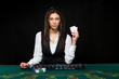 © nazarovsergey - The beautiful girl, dealer, behind a table for poker