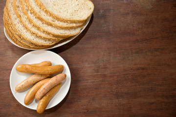 Wall Mural - slice brown cut plain bread with dish of Sausage