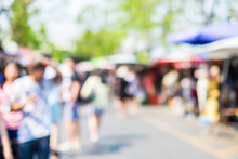 Blurred Background : People Shopping At Market Fair In Sunny Day