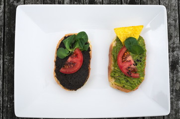 Guacamole bread roll and black olive pate bread roll top view