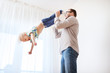 © Syda Productions - father with son playing and having fun at home