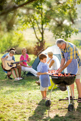 Wall Mural - Generation family at barbecue grill.