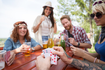 Close up of cards in hands of male