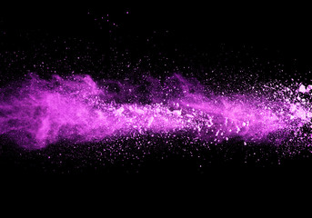 Wall Mural - Explosion of purple powder on black background
