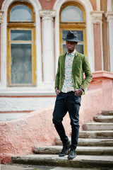 Fashion portrait of black african american man on green velvet j