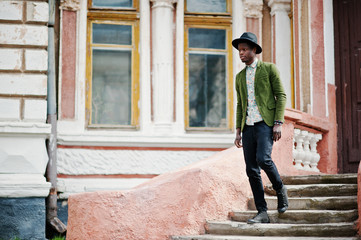 Fashion portrait of black african american man on green velvet j