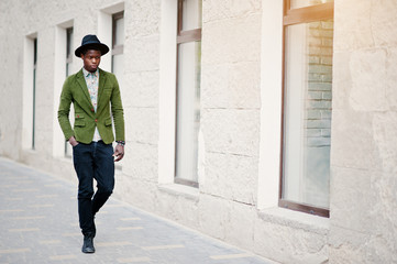 Fashion portrait of black african american man on green velvet j