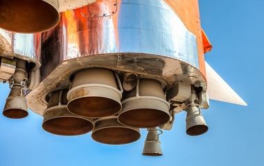 Wall Mural - detail of space rocket engine against the blue sky
