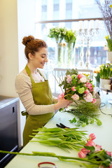 Wall Mural - smiling florist woman making bunch at flower shop