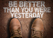 Top View of Boot on the trail with the text: Be Better Than You Were Yesterday
