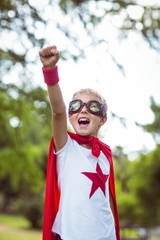 Wall Mural - Little boy pretending to be superhero