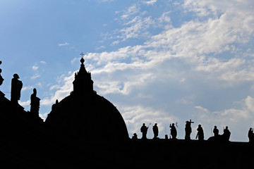 Silhouette of St. Peters Basilica over blue sky in Rome, Italy