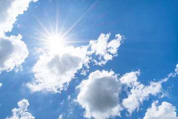 Wall Mural - Looking up at Nice blue sky with sun beam behind big cloud