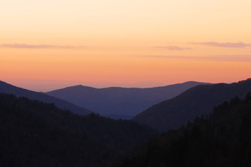 Wall Mural - mountain and valley in mist under sunset twilight