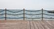 Empty wooden seafront with fence