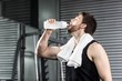 © WavebreakmediaMicro - Fit man drinking water