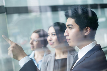 Business team looking out of window