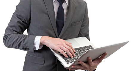 Wall Mural - Businessman holding laptop isolated on white background.