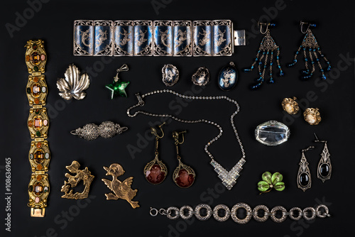 Stampa su Tela Antique vintage jewelry collection on black background