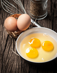 Sticker - Eggs and whisk on wooden table