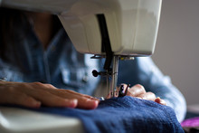 Closeup Of A Woman Using A Sewing Machine