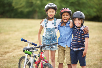 group of children with bike and scooter