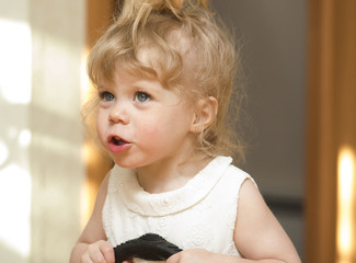 Little girl  looking up with her mouth open.