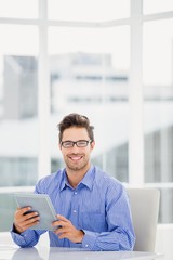 Poster - Businessman holding a digital tablet