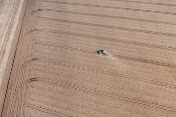 aerial view of the tractor on the harvest field