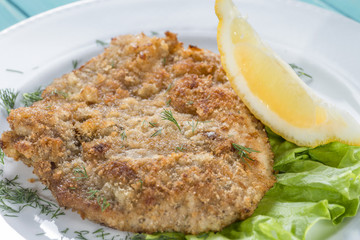 restaurant menu, fish fillet in breadcrumbs