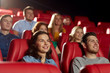 © Syda Productions - happy friends watching movie in theater