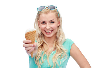 Wall Mural - happy young woman in sunglasses eating ice cream