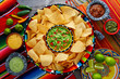 Nachos with guacamole tortilla chips sombrero